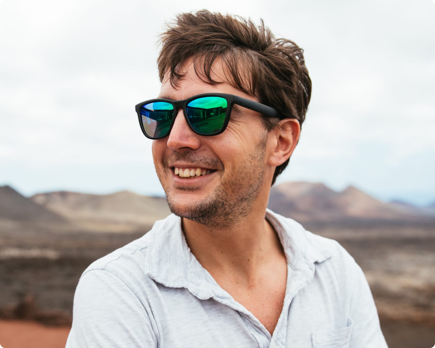 Man with shades on, smiling