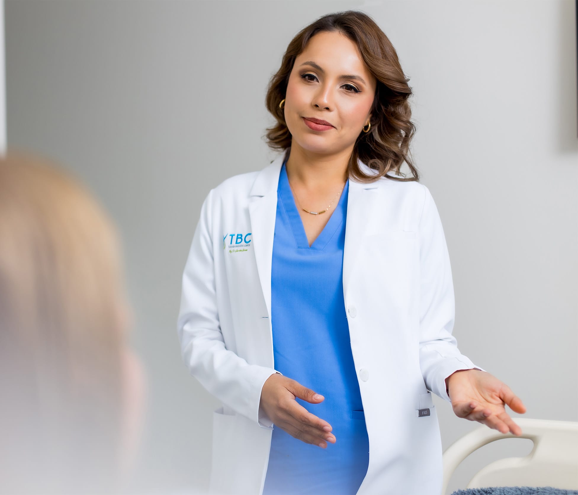 Dr. Marcela Olague speaking with patient