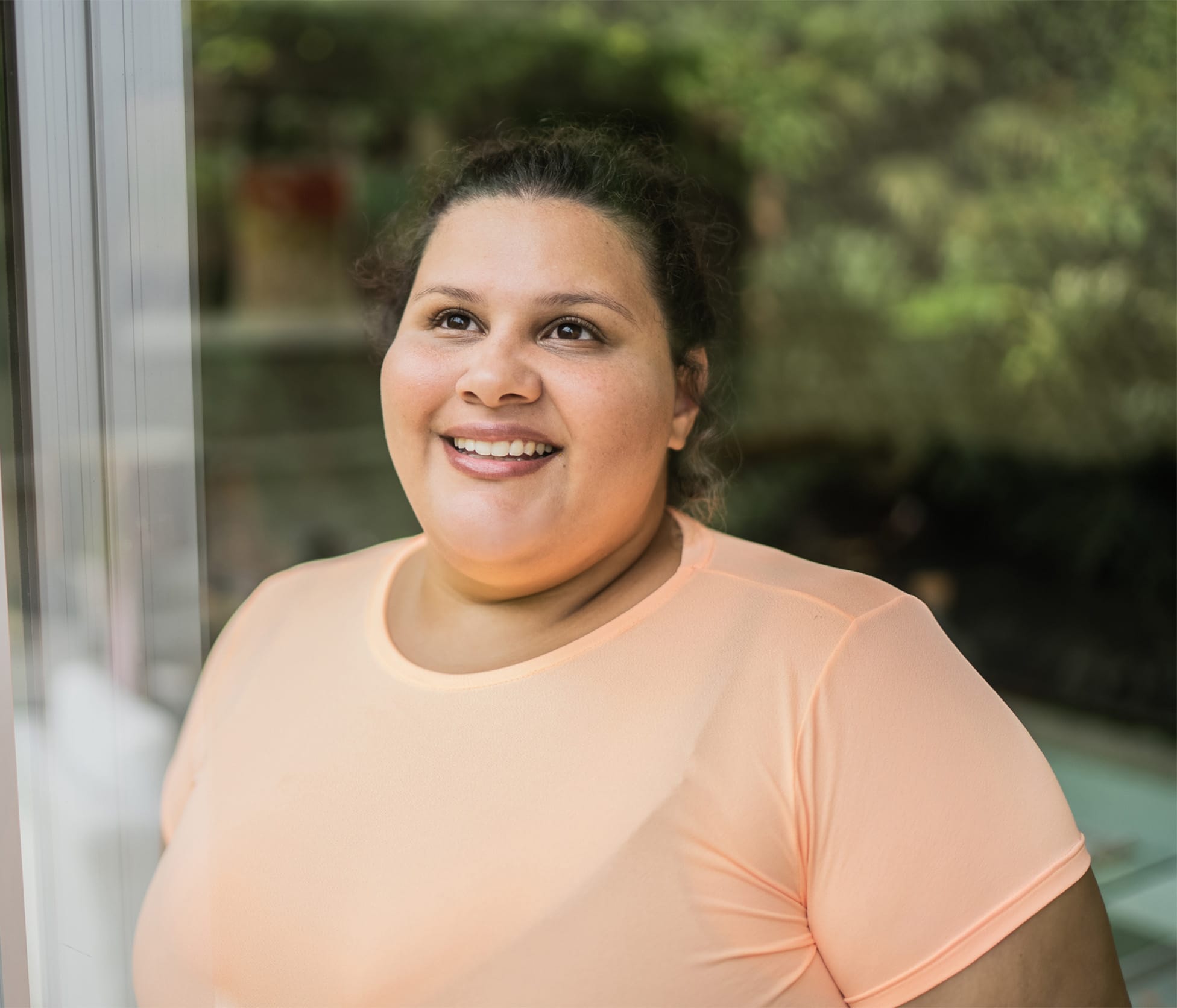 Woman smiling and looking up