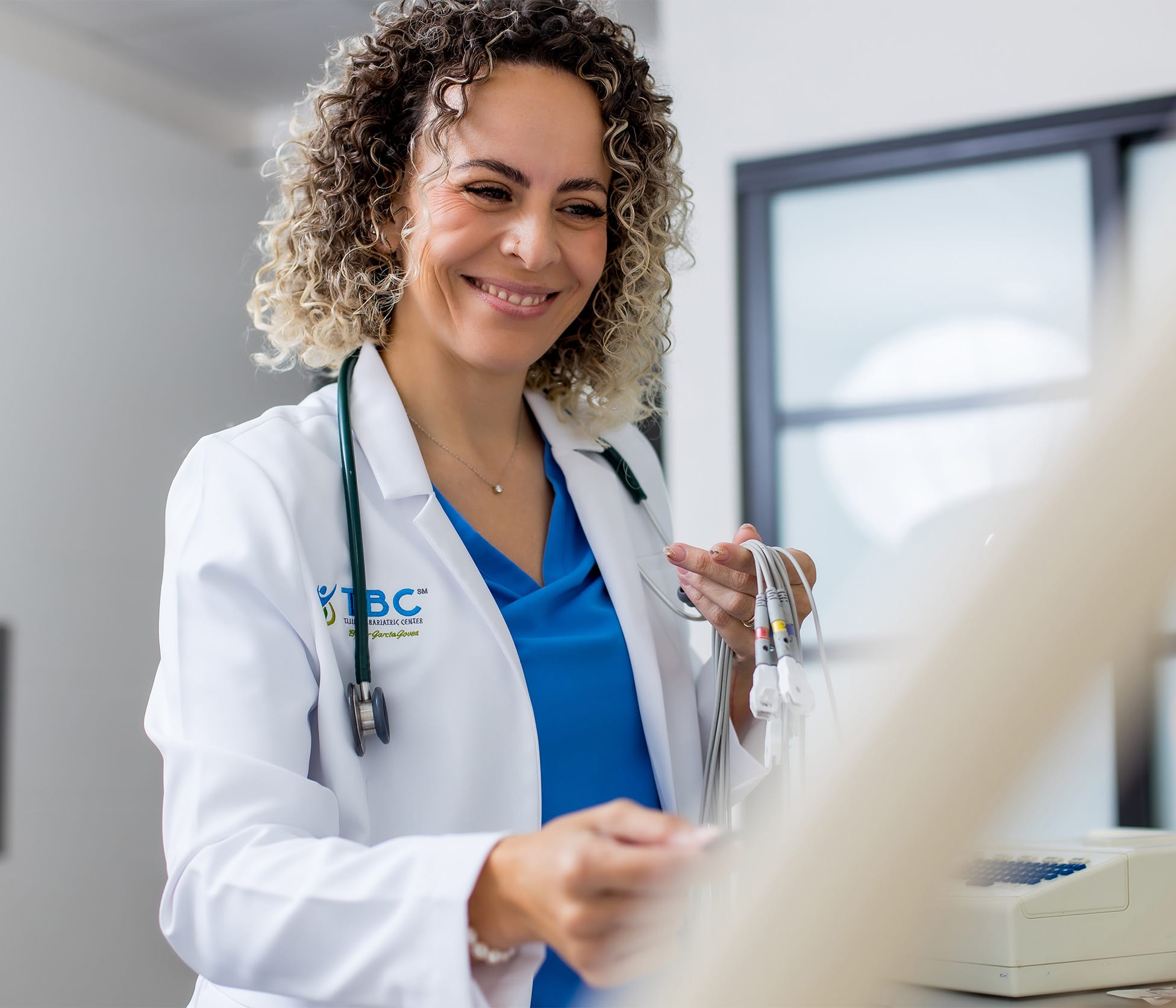 Dr. Paola Velazco Gerardo Smiling and treating patient