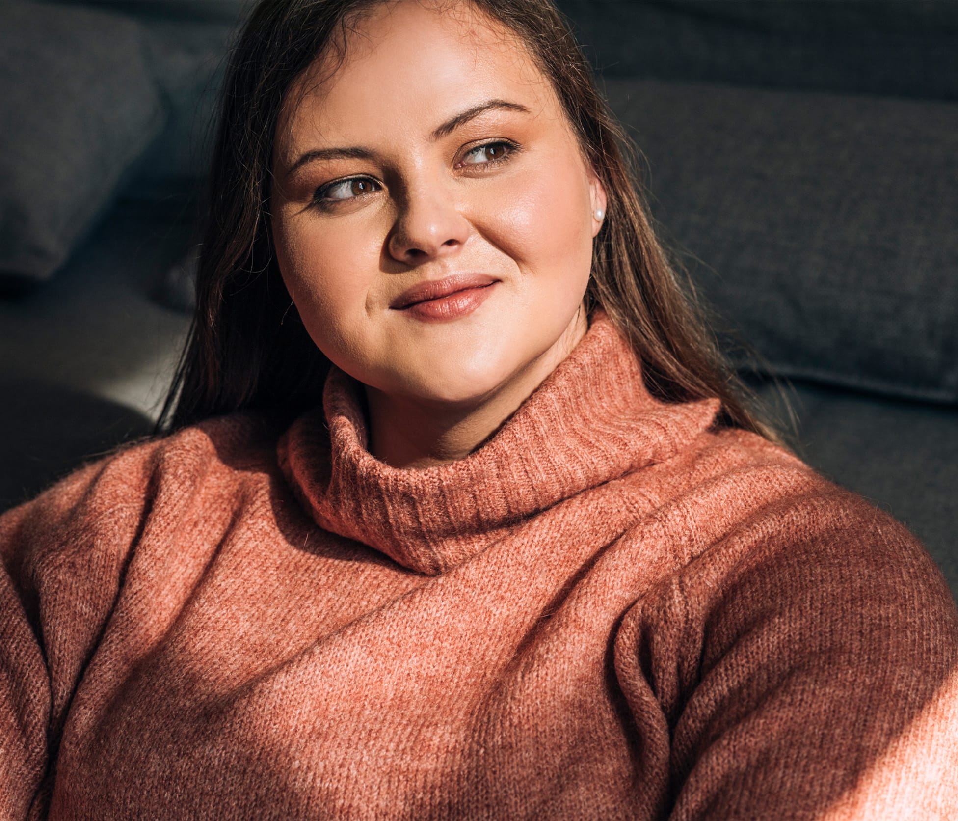 Woman smiling and looking outside