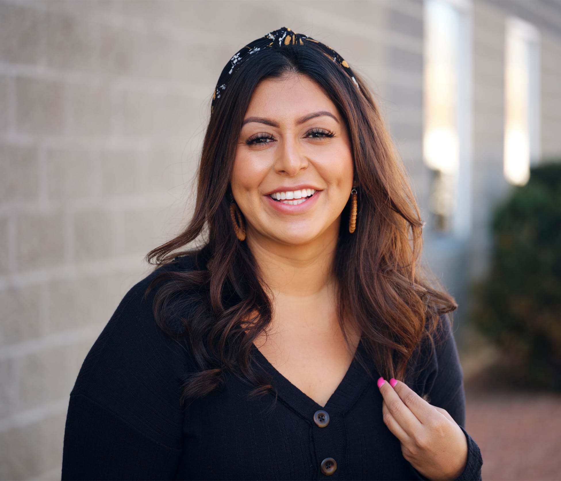 Woman smiling and standing outside