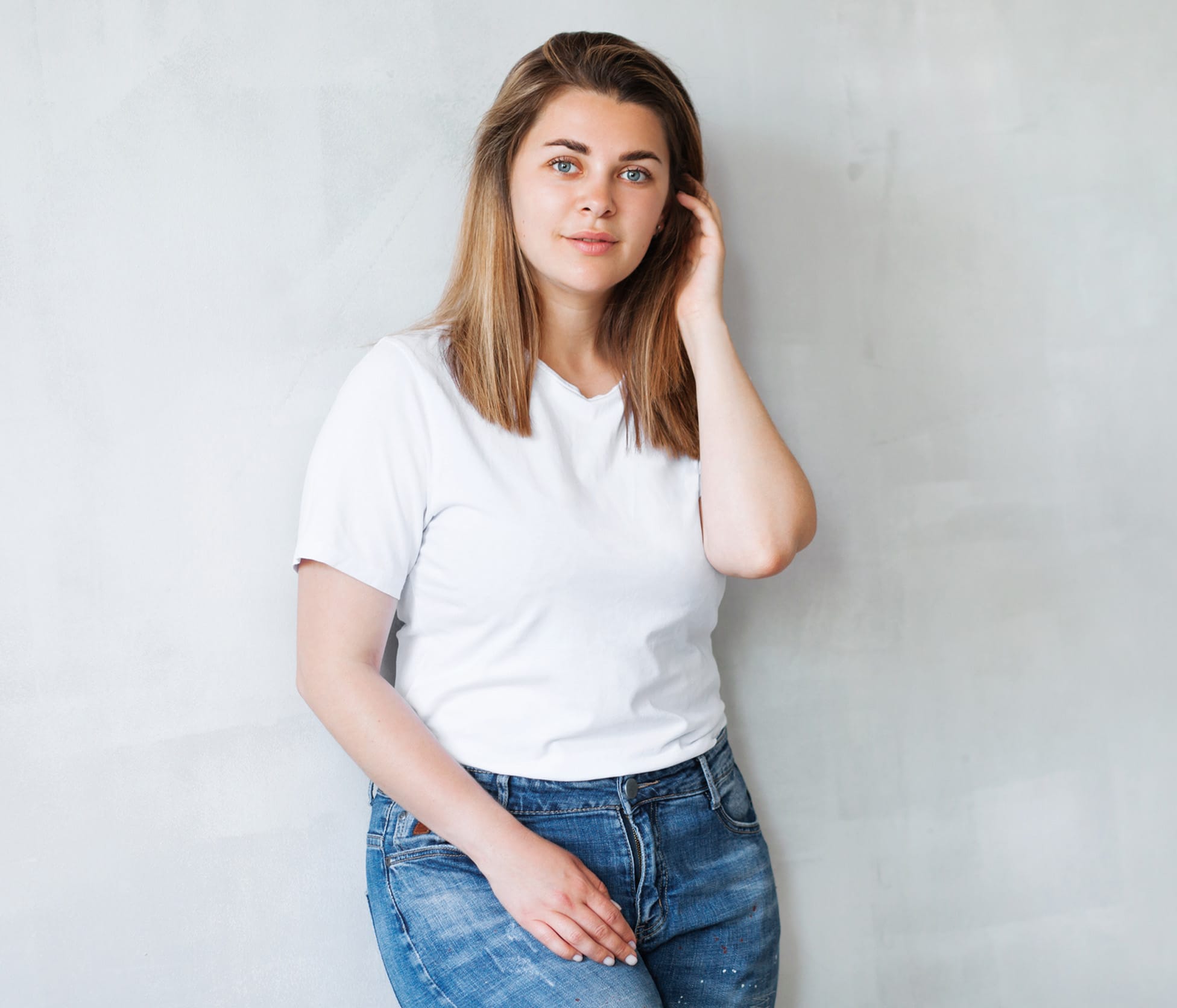 Woman leaning against wall