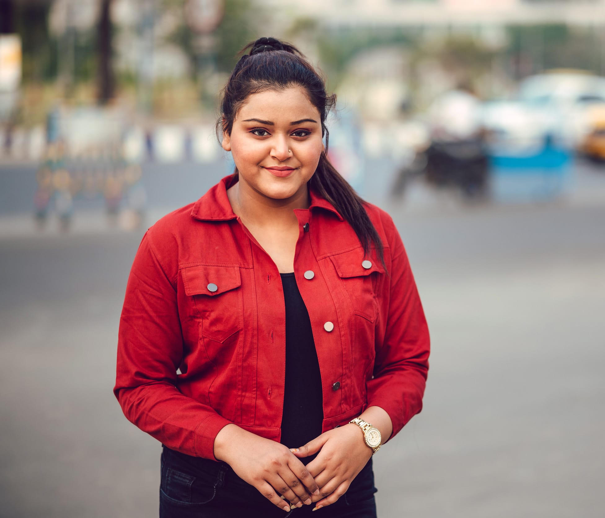 Woman smiling and wearing red coat