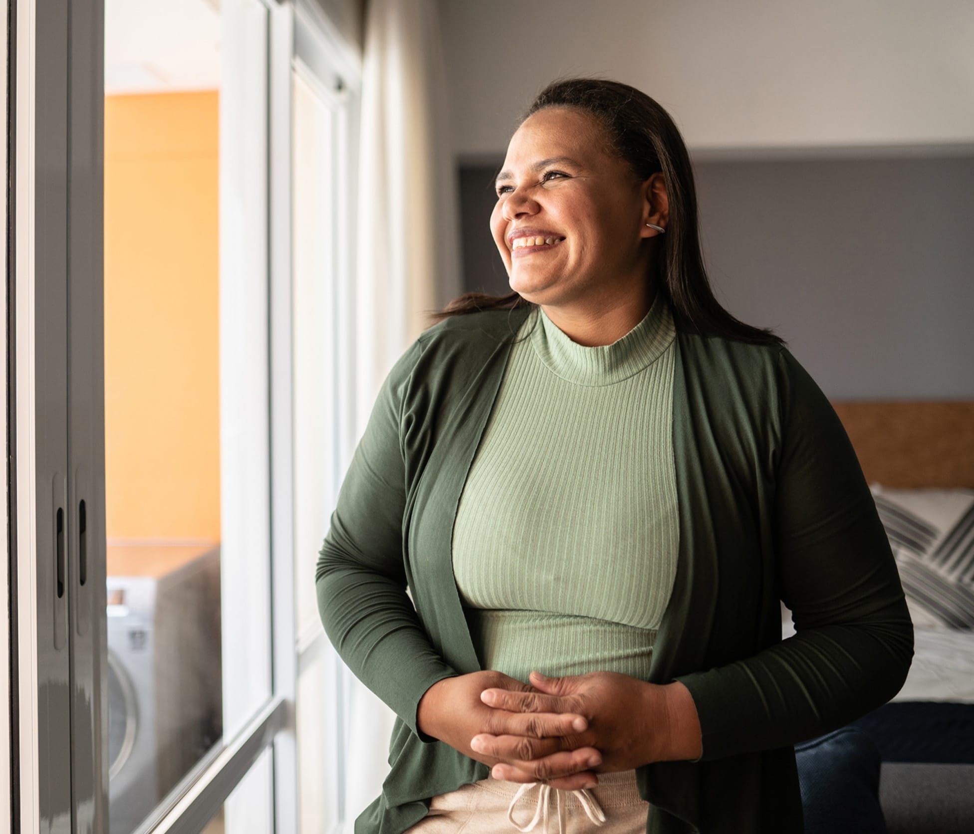 Woman smiling and looking out the window